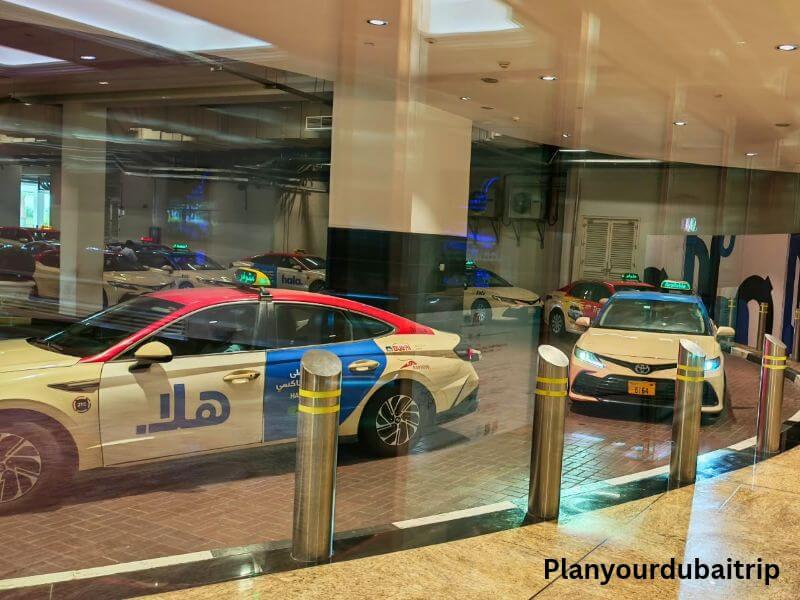 Dubai taxi Dubai taxis waiting at the taxi pick-up area at Mall of the Emirates.
